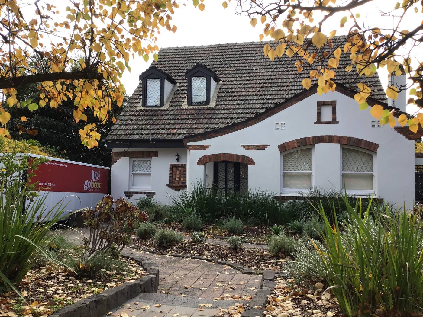 gobox unit outside a heritage home in autumn