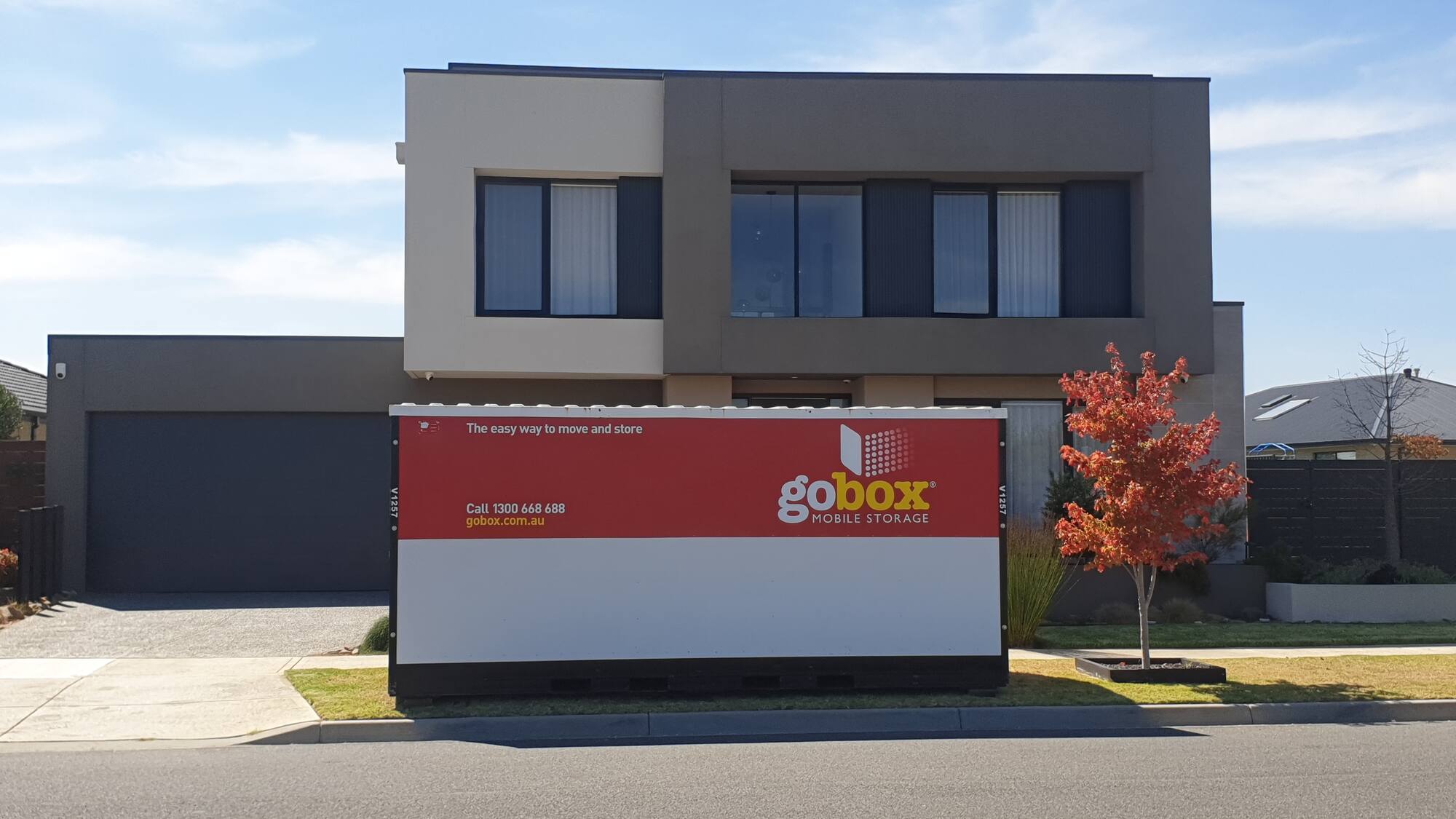 gobox unit parked outside a modern home ready for packing