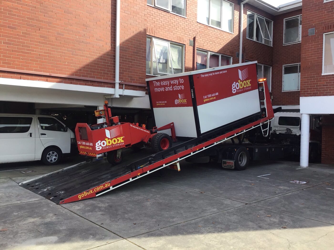 gobox storage unit being placed in the car park of an apartment block